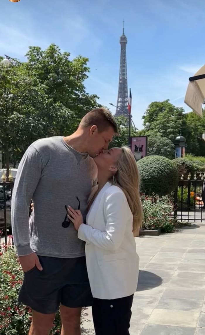 Camille Kostek and Rob Gronkowski in front of the Eiffel Tower in France.